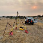 Caltrans set up for GPS on Benchmark with smoke from nearby fires filling the air
